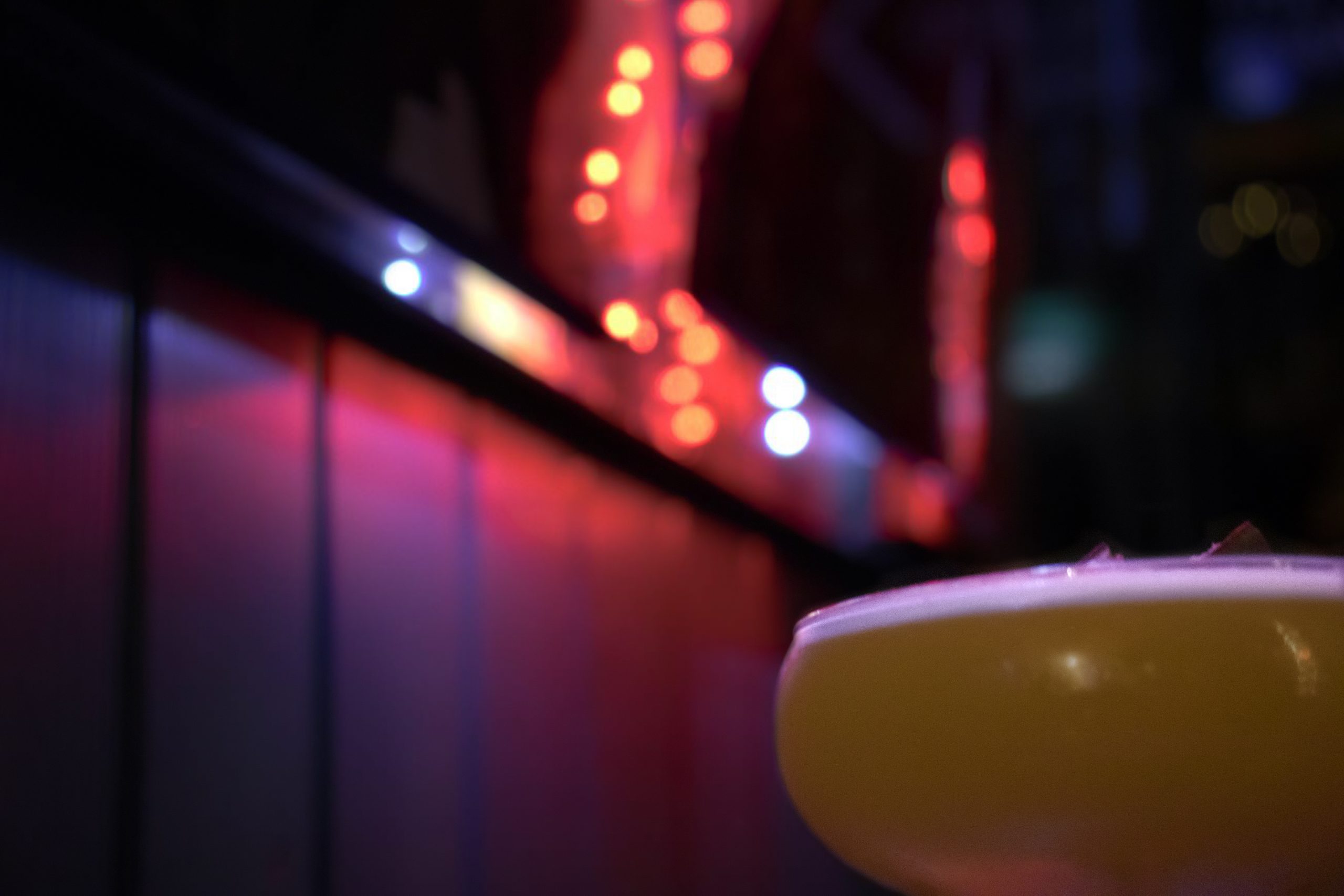 Cocktail surrounded by neon lights